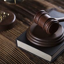 gavel resting on legal book 1-5bdca9c7e8ebe.jpg