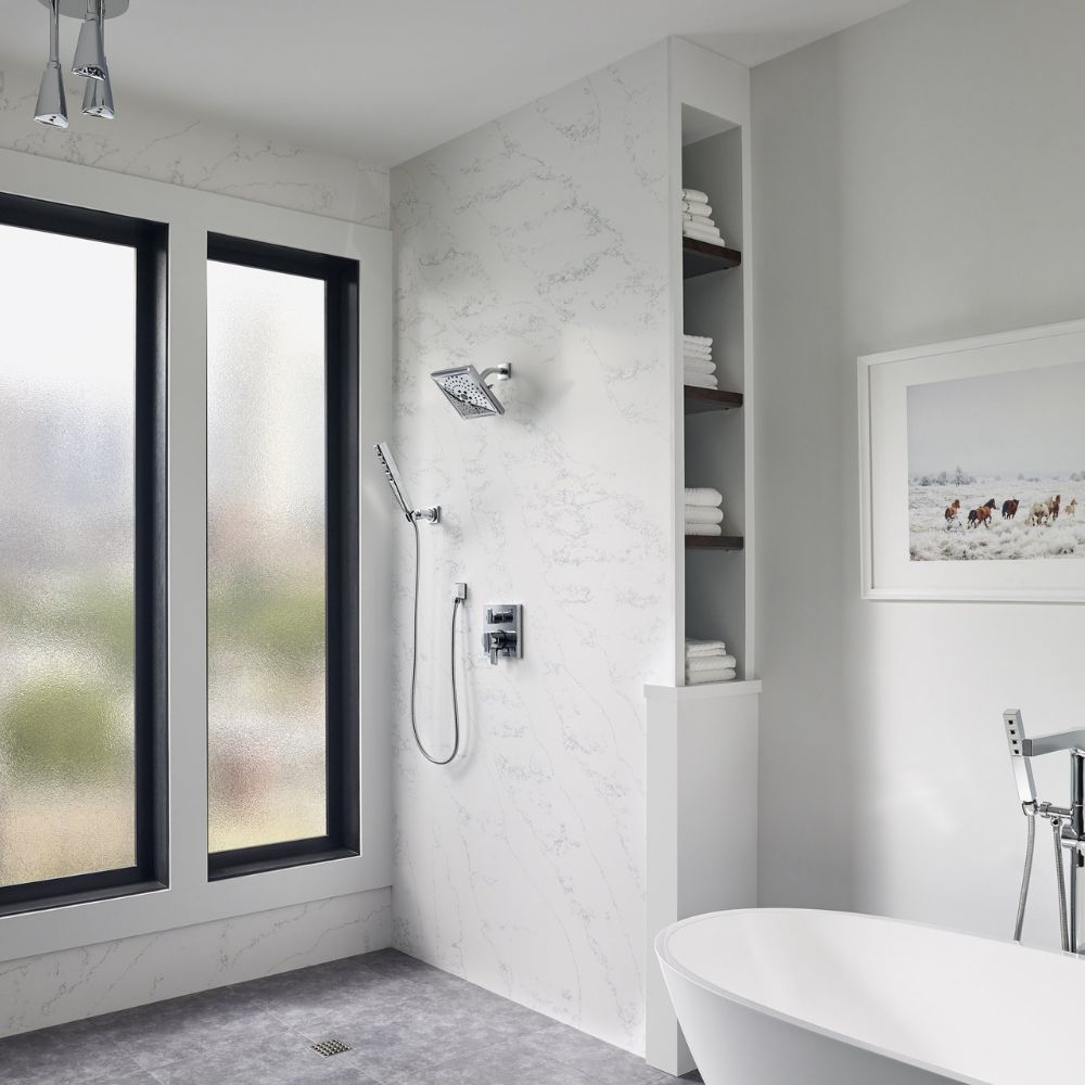 a modern bathroom with marble shower walls