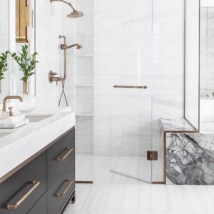 a white and dark marble colored bathroom