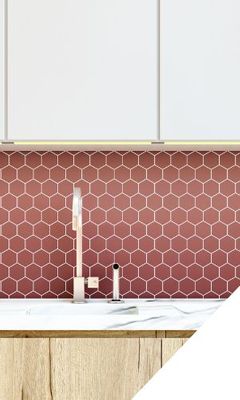 Kitchen sink with red hexagon tile backsplash