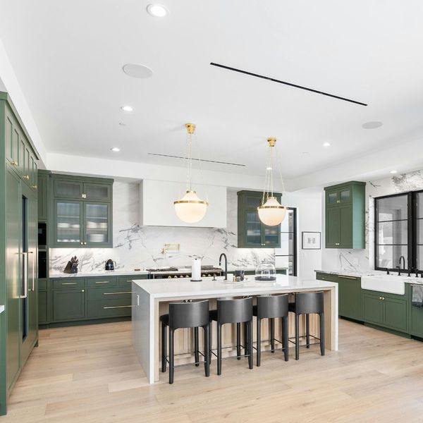 U-shaped kitchen with green cabinets