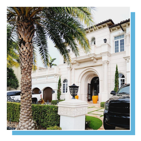 Miami style luxury home with arched entry way