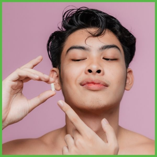 man holding a vitamin