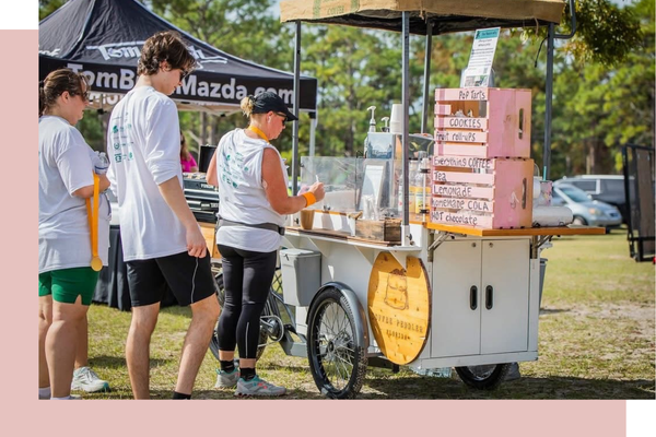 people ordering from the coffee cart