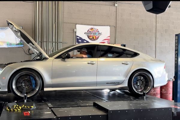 Tech inside of car getting dyno tested Tech inside of car getting dyno tested