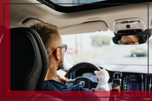 Person driving down a road