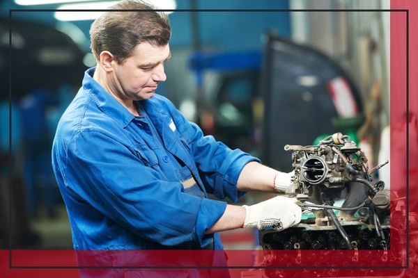 Person looking at a car engine