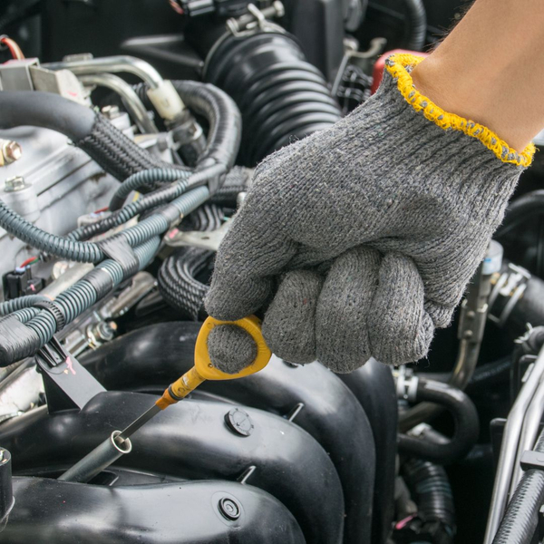 checking oil stick in engine