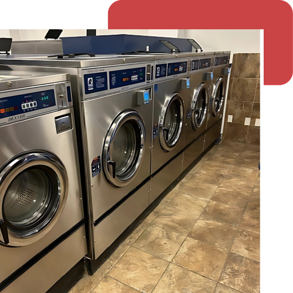  row of large, industrial silver dryers along a wall