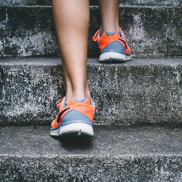 Woman stepping up stairs