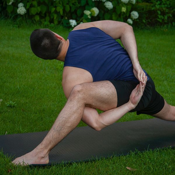 flexible man on yoga mat