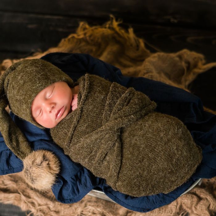 Newborn baby wrapped in a blanket. 