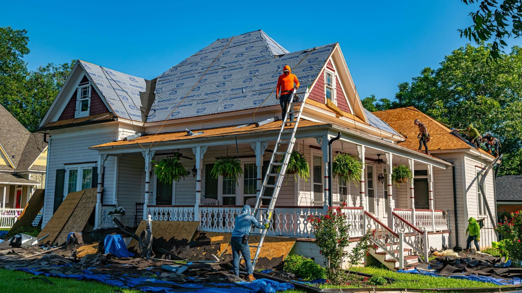 working on roof of extended home