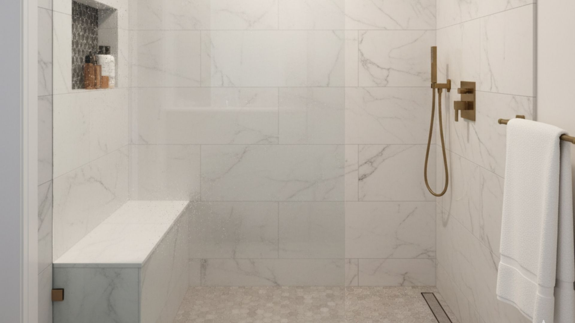 A luxurious walk-in shower featuring large white marble-look tiles on the walls, a built-in bench, and a light hexagon tile floor. A luxurious walk-in shower featuring large white marble-look tiles on the walls, a built-in bench, and a light hexagon tile floor.