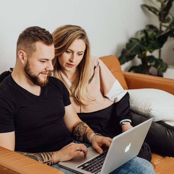 couple making list on computer