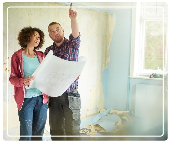 contractor walking through remodel with client 