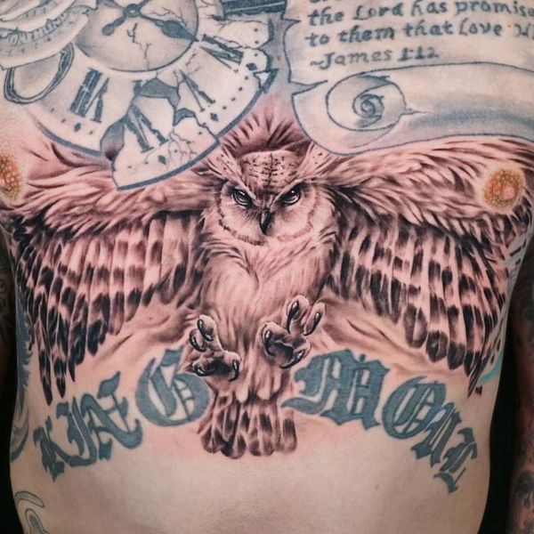 An owl tattoo on a chest