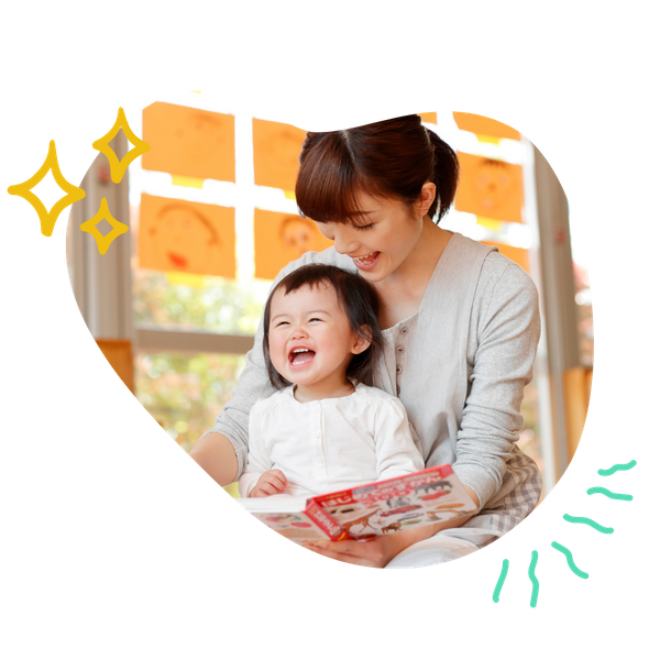 An educator reading to a child.