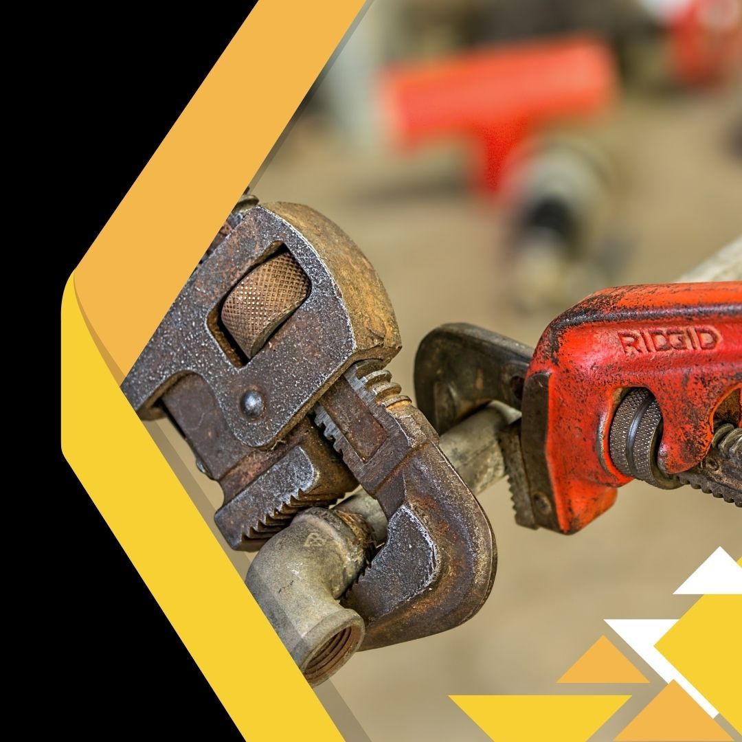 plumbing wrenches on pipes 