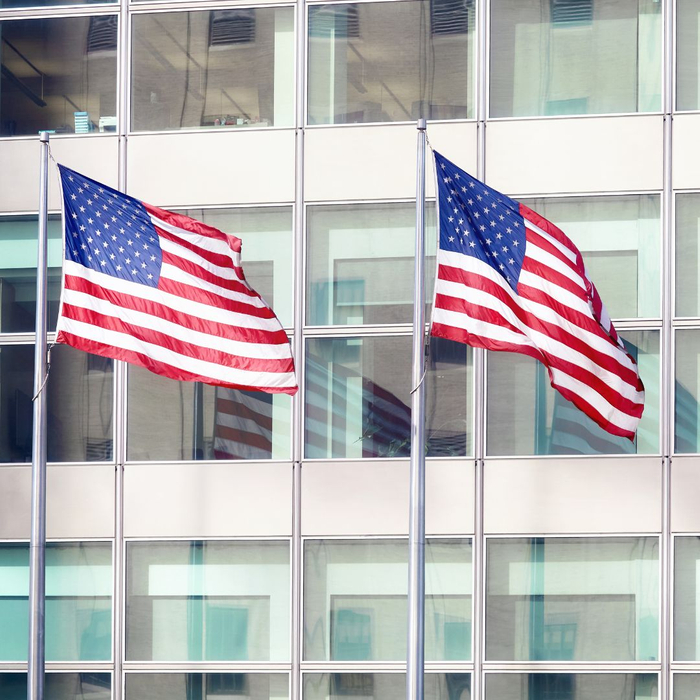 american flags in front of business