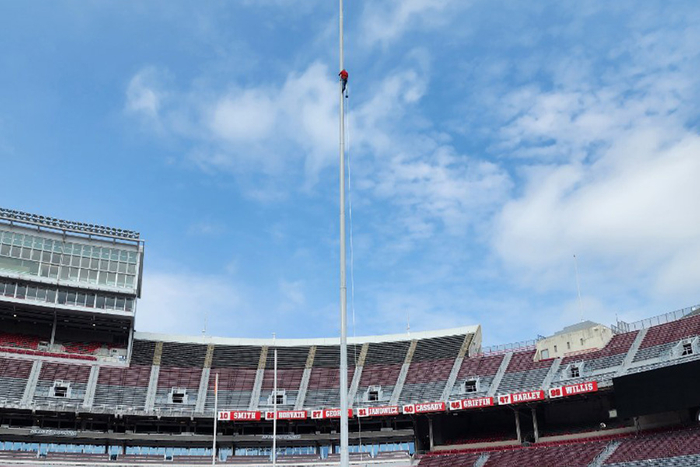 climbing flagpole at the stadium