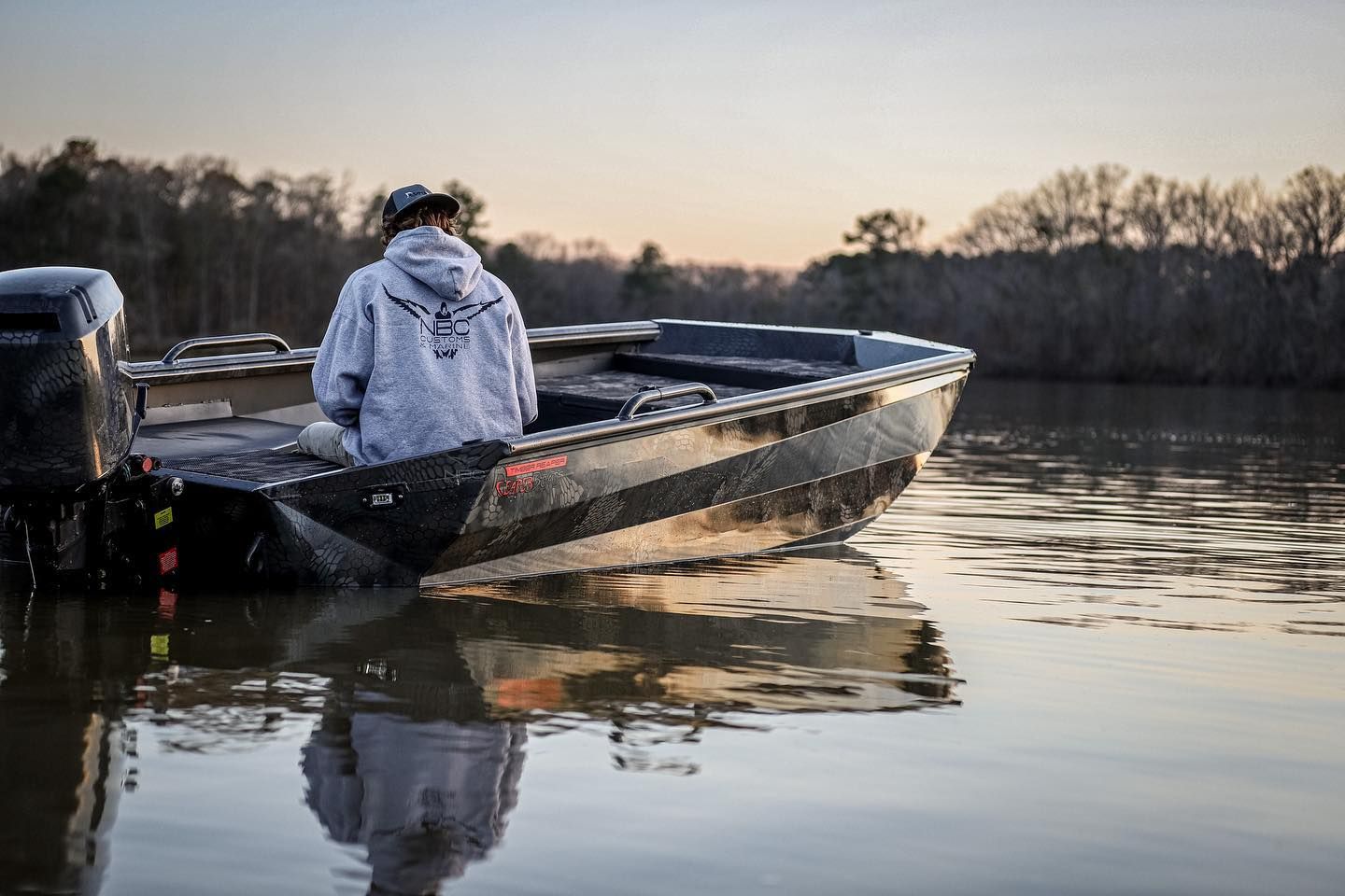 hunter on lake in boat