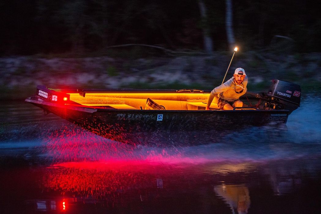 man with boat at night