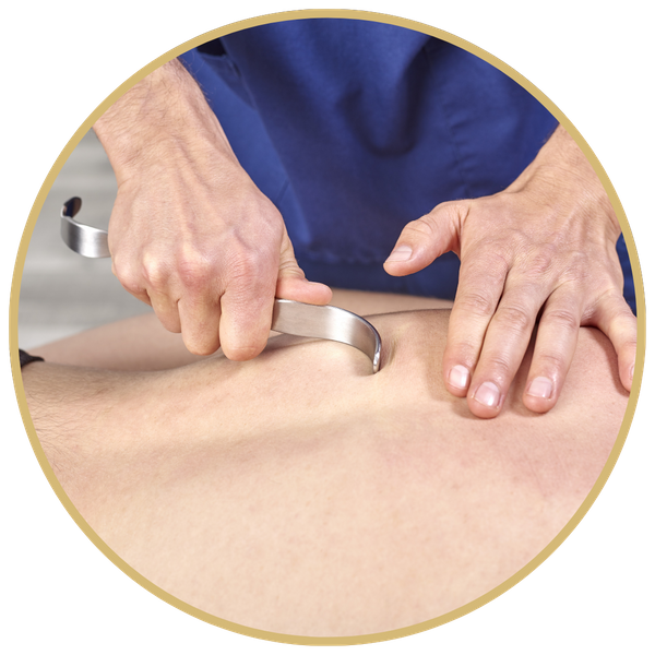 A masseur performing muscle scraping