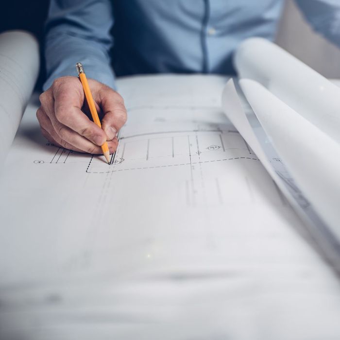 Architect draws on blueprints