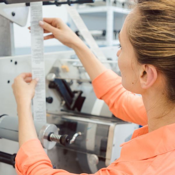 A person working with a label printer