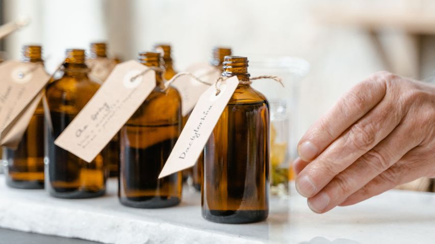 amber glass bottle with paper tags