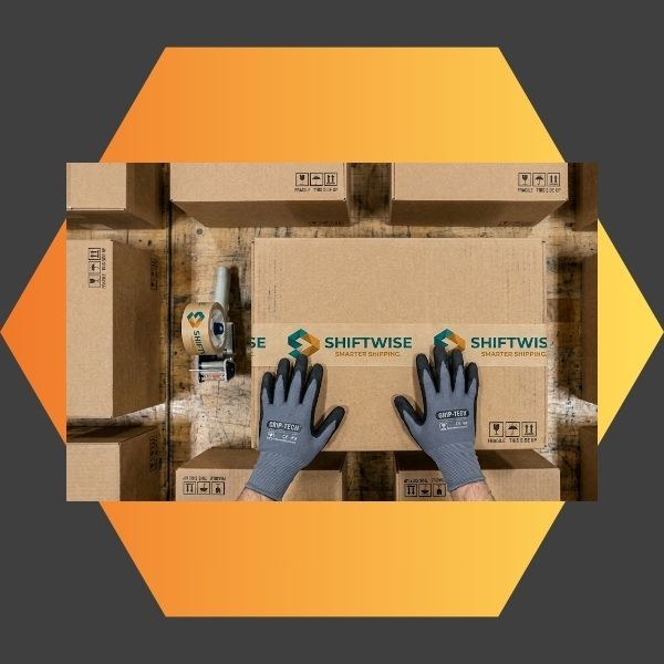 A worker's gloved hands sealing a cardboard shipping box with custom printed tape from Impression Label to enhance brand visibility.
