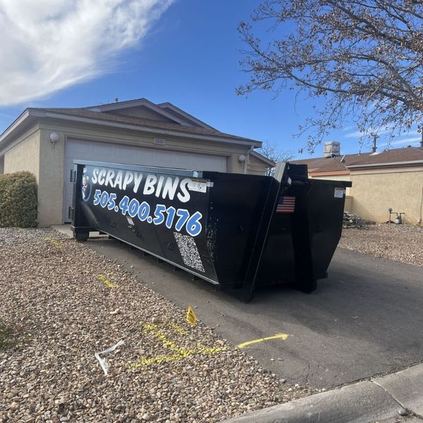 roll-off dumpster in driveway