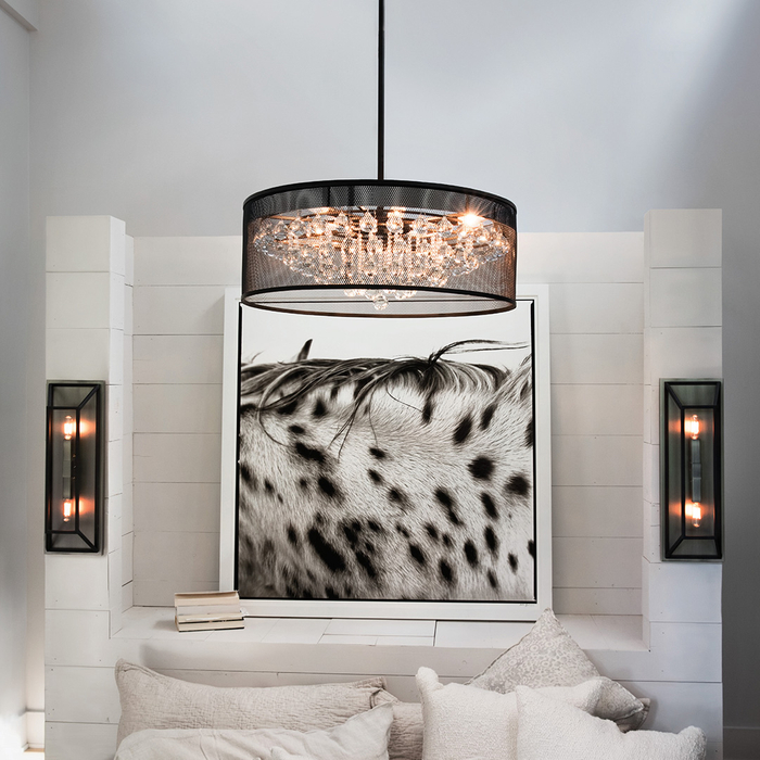 A chandelier and sconces in bedroom