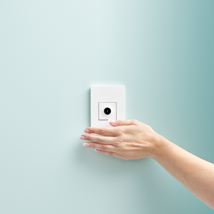 Motion light switch with hand sweeping across it