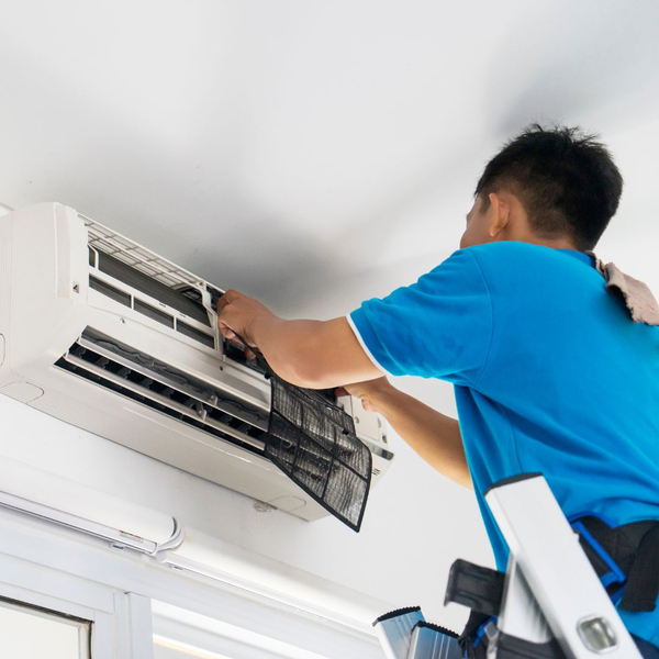 contractor repairing air conditioner
