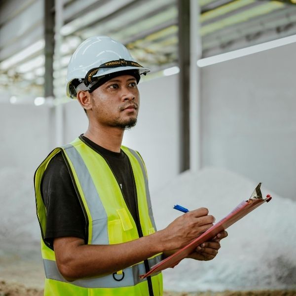 construction workers taking notes inside of building