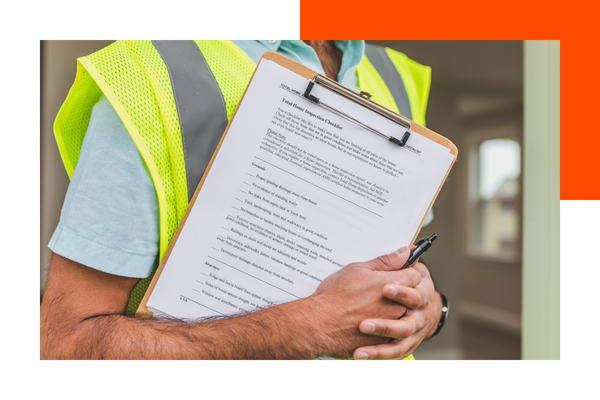Contractor holding a clipboard