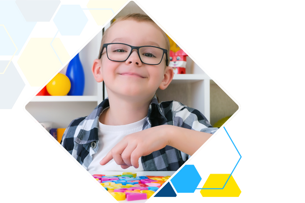 kid with glasses smiling