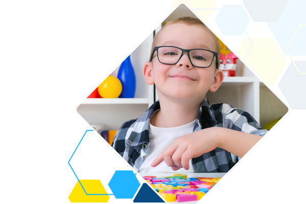 happy boy with alphabet magnets 