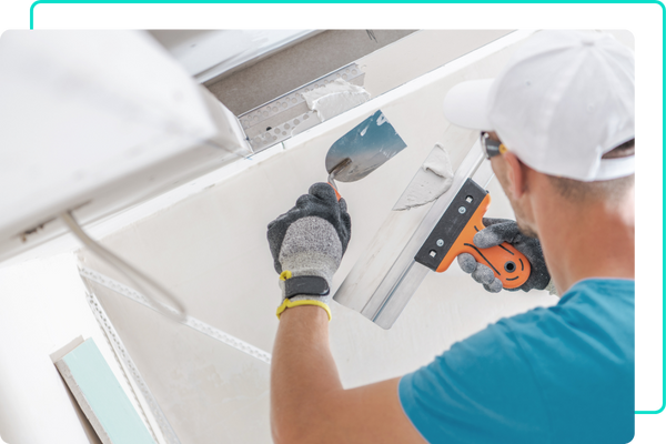 Man repairing drywall