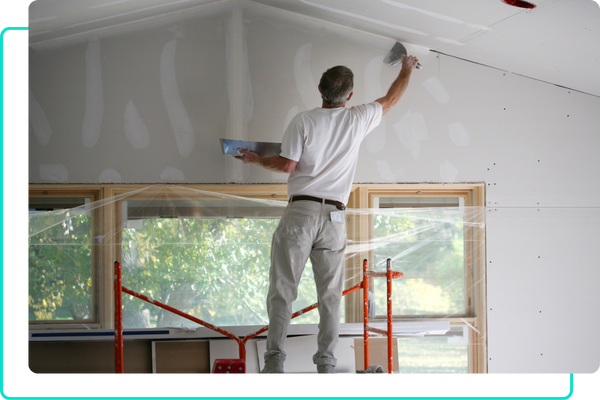 Man repairing drywall