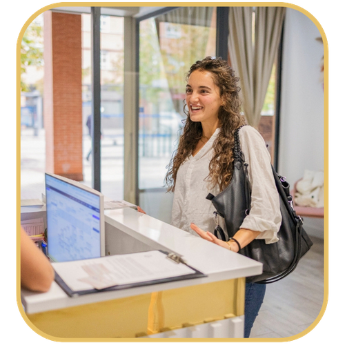 A woman checking in for an appointment at a clinic