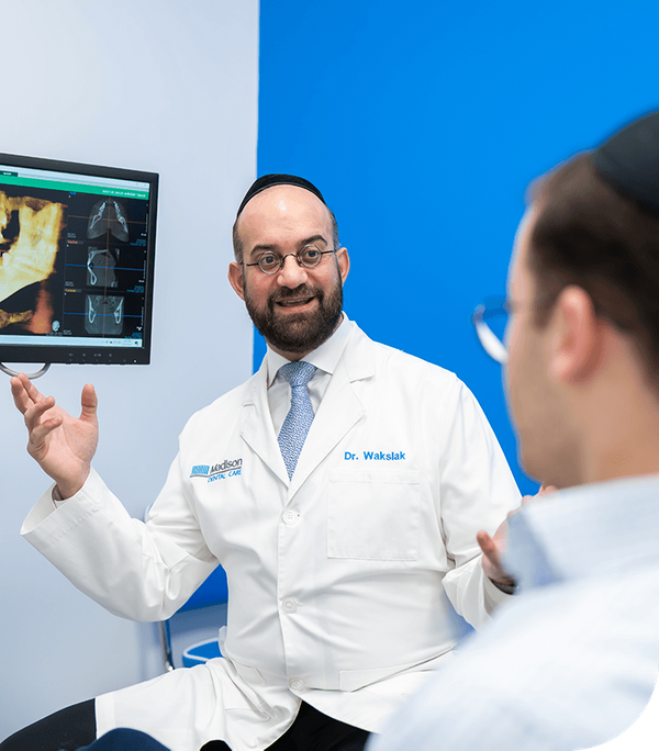 Dr.  David Wakslak explains dental imaging to patient