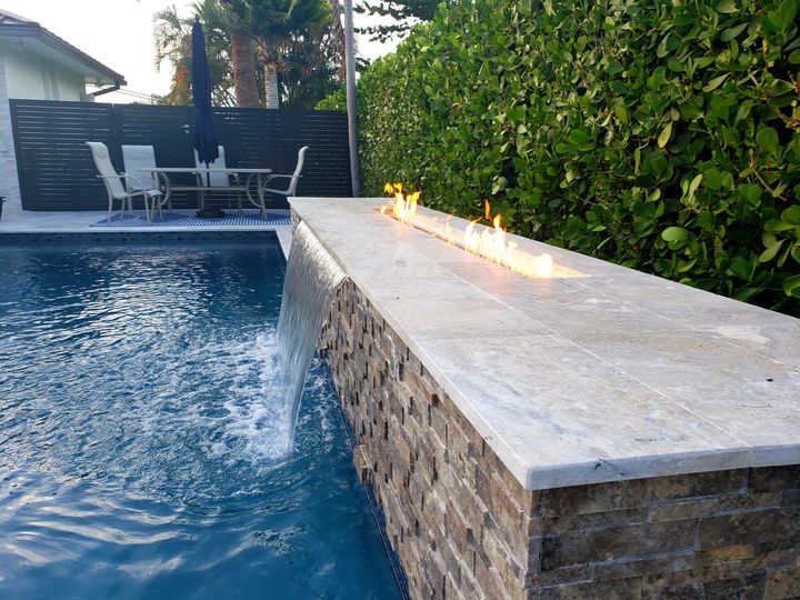 closeup of firepit/waterfall and pool