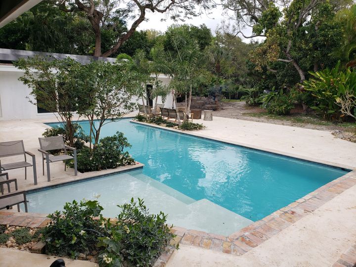 beautifully finished pool in a backyard