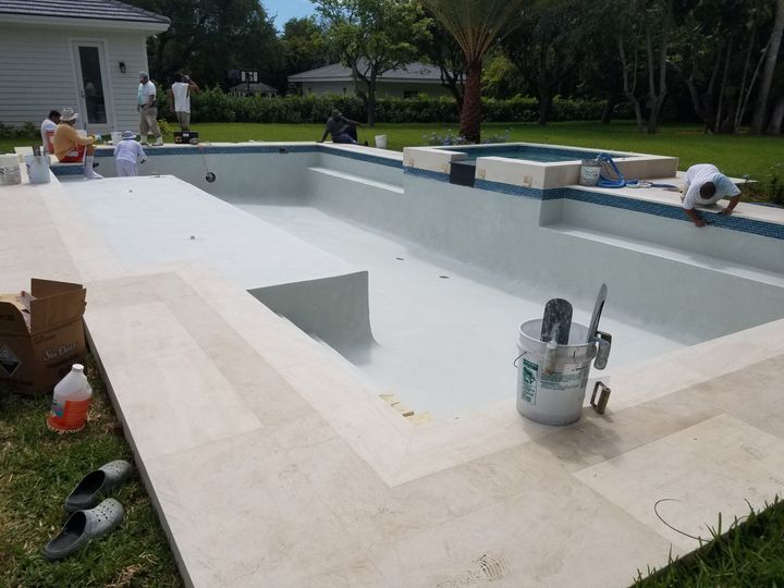 crew finishing a pool surface