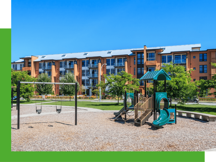 Apartment complex playground with professional landscaping