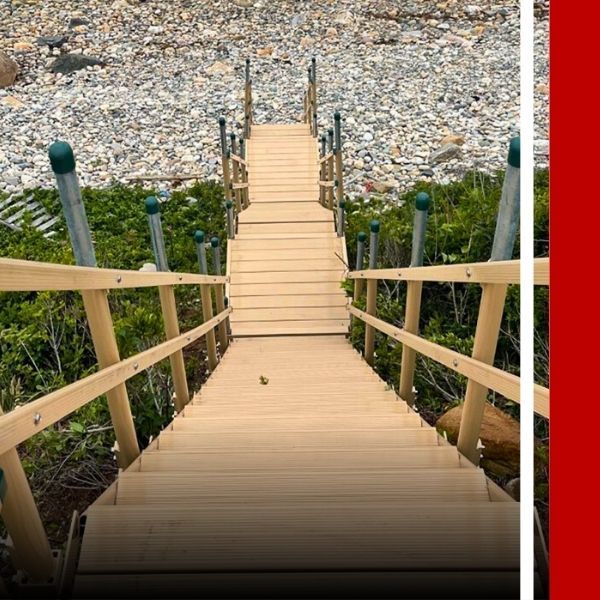 metal stairs leading down hill to beach