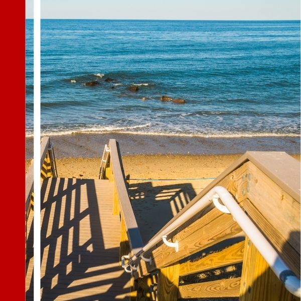 stairway to the beach with a railing